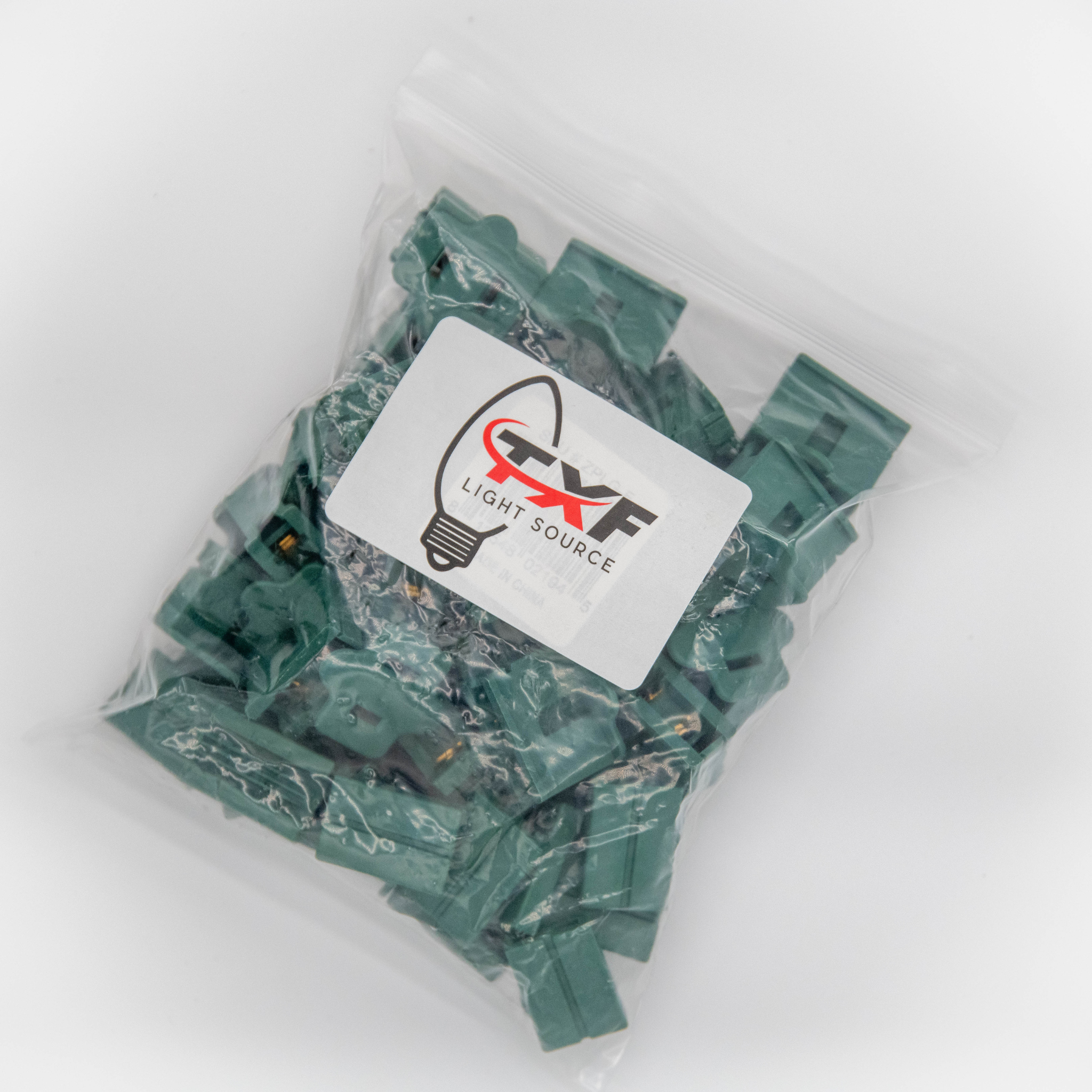 bag of female slide plugs in green